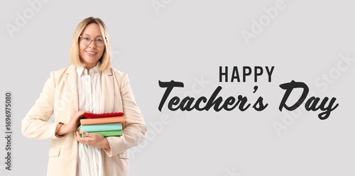 Female teacher with books o...