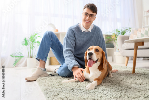 Young man in eyeglasses pet...