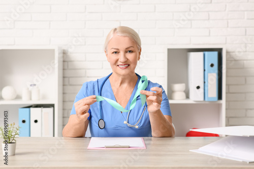 Mature female doctor with t...