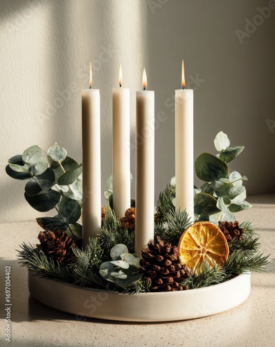 Minimalist Christmas photo of a handmade Advent wreath. Cozy rustic design with ivory candles, pinecones, and soft daylight create a serene Scandinavian holiday scene