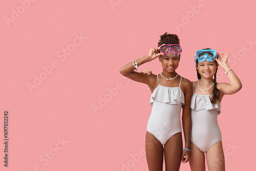 Cute little girls in swimsu...