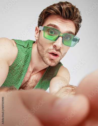 Surprised Man in Green Sunglasses Reaching Toward Camera