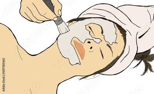 Woman receiving a deep facial cleansing with a brush brushing cream onto her face. Color image