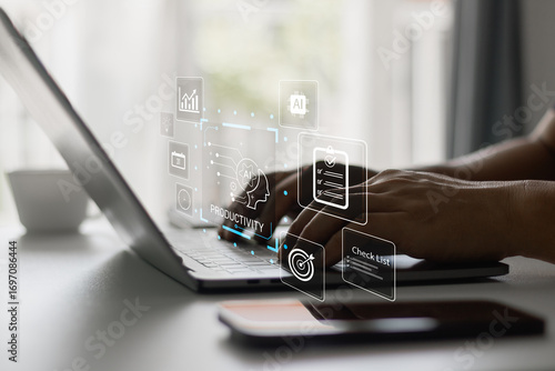 Person typing on laptop with digital interface icons showing AI productivity, checklist, data analysis, and task management tools for efficiency, business innovation and smart technology.