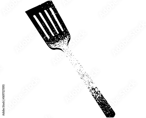 Vector Disintegrating spatula with scattered particles.