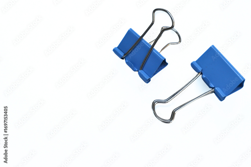 two blue paper clips on a white background