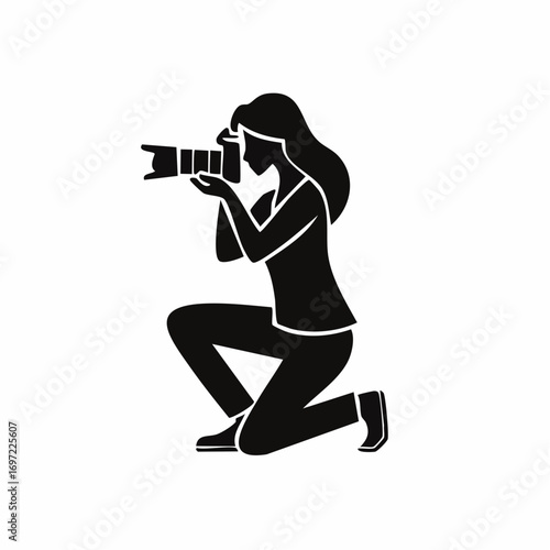 Female photographer silhouette, kneeling with a camera to capture a shot. Icon for photography, creativity, and media.