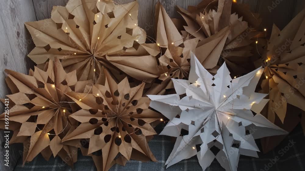Before and after craft bags transform into snowflakes. Sustainableminded Christmas cozy home handmade decoration. Tutorial for making do it yourself craft paper lunch bags and hot glue. Seasonal