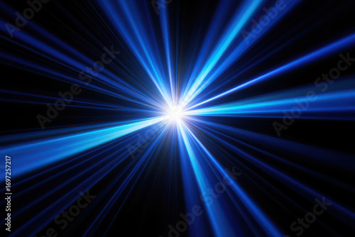 Bright blue starburst of light rays emanating from a luminous core in darkness