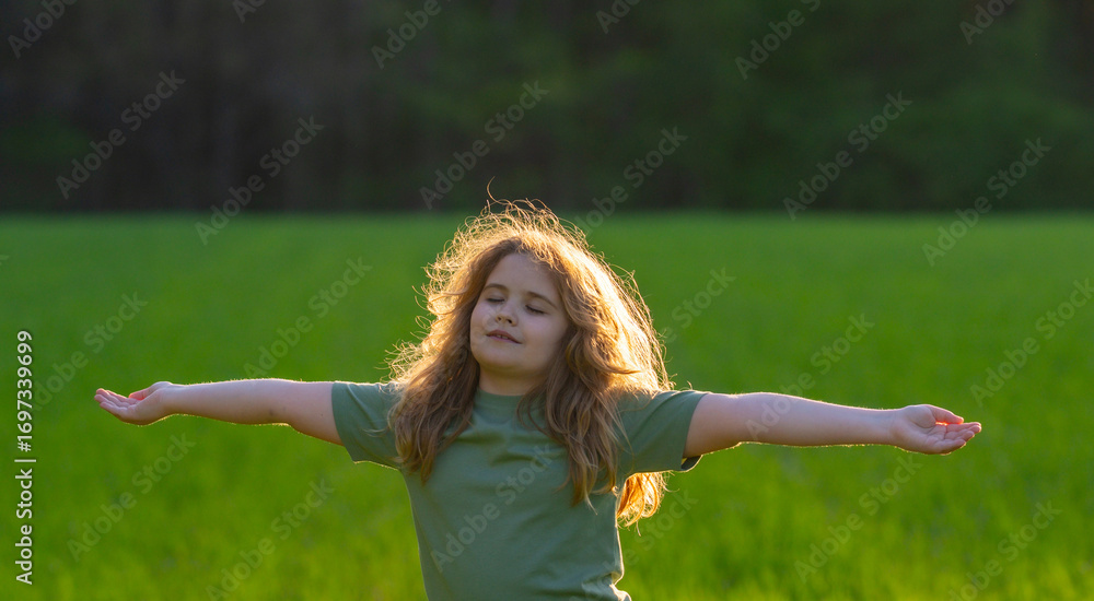Obraz premium Freedom of dreaming child. Kid enjoying carefree and freedom. Kid meditation in nature. Dreams of kids freedom. Peaceful child portrait. Kids peace and freedom. Nature harmony. Mind and calm kid.