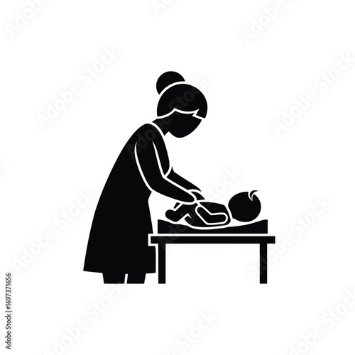 Black silhouette icon of a mother changing her baby's diaper on a changing table.