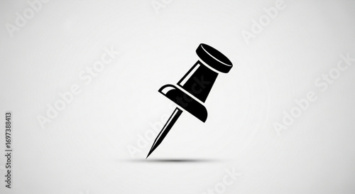 A black pushpin, used for securing paper or marking locations on a map