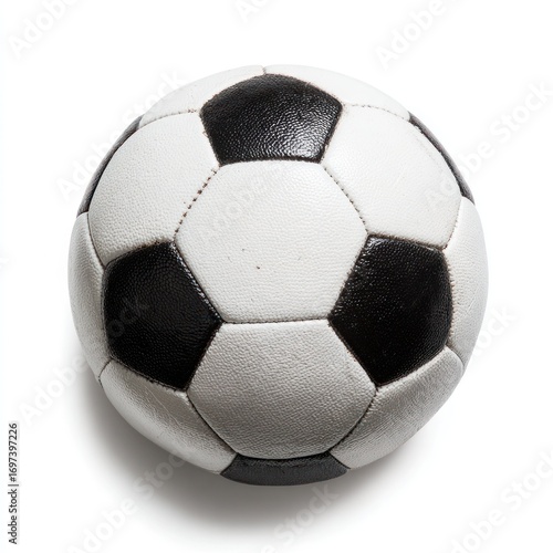 Black-and-white soccer ball casts shadow on plain background, showing detailed seams and spherical form