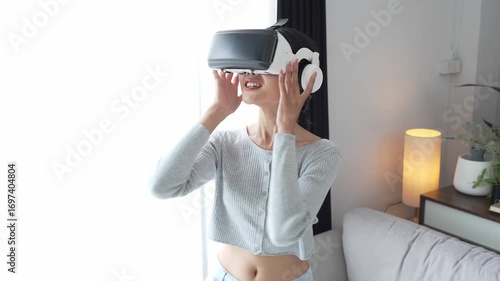 Asian Woman Playing VR Games at Home.
