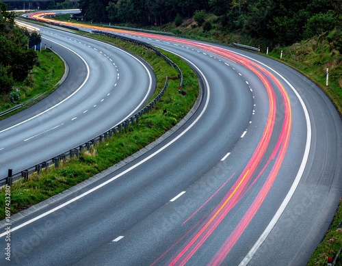 Dynamic Light Trails on a Winding Highway at Night