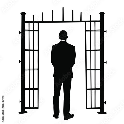 Silhouette of a man in a suit standing at an open archway