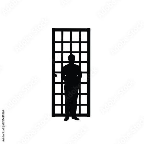 Silhouette of a man standing in front of a grid door Keywords: silhouette, man, person, standing