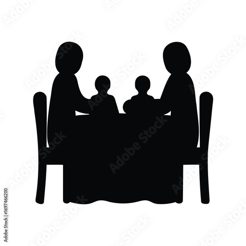 Silhouette of family of four seated around a table with tablecloth