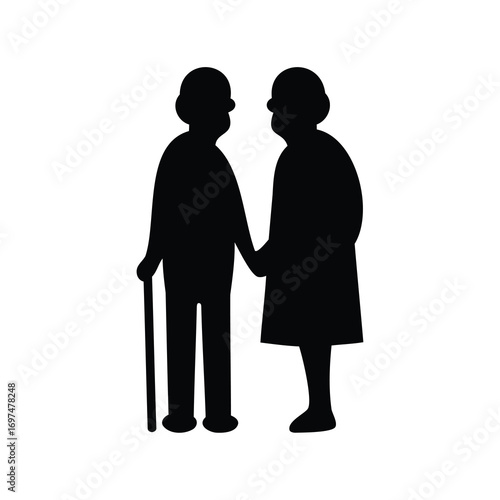 Silhouette of an elderly couple holding hands and walking together in love