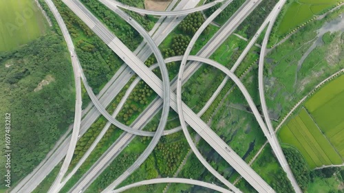 Aerial view of highway junction with traffic on the road. 고속도로 교차로.