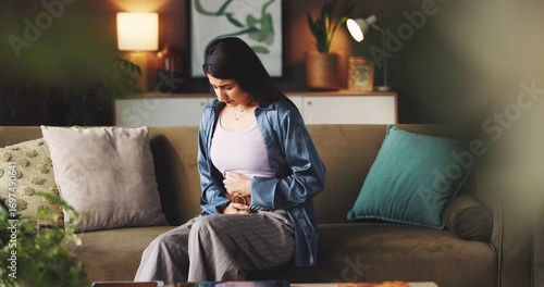 Canvas Print Cramps, sick and woman with stomach pain on sofa from menstrual cycle, bloating or endometriosis