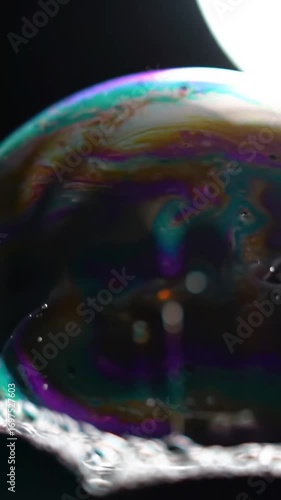 footage vertical video, Close-up of a soap bubble reflecting light