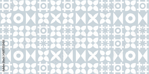 Seamless geometric pattern with white abstract shapes on a light blue background