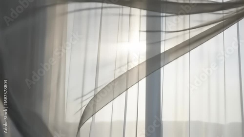 Soft curtains billowing in a sunlit room, casting gentle shadows on the floor, creating a serene atmosphere