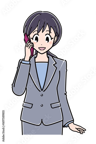 スマートフォンで電話をしているスーツのOLさん（上半身）