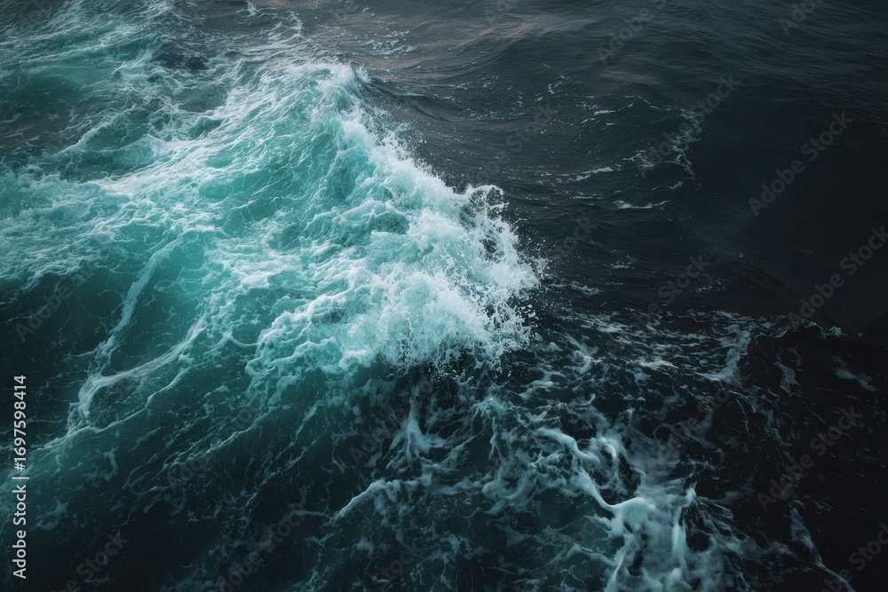 Fototapeta premium Turquoise Waves Crashing on Dark Ocean Surface at Dusk