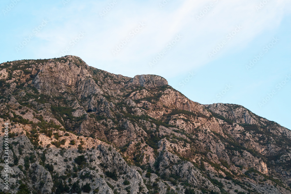 Fototapeta premium Majestic rocky mountain peaks under a clear sky
