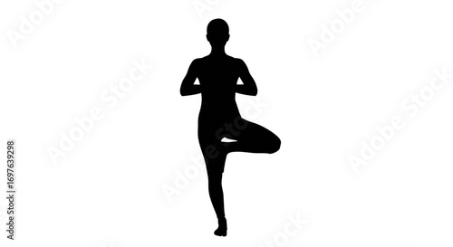 Silhouette of a poised woman in tree pose showcasing harmony and balance in yoga practice