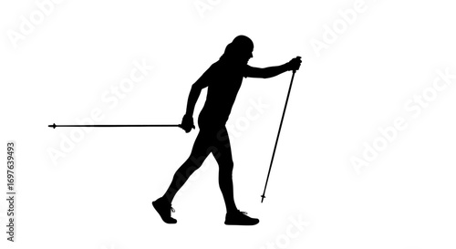 Silhouette of cross-country skier navigating through crisp winter landscapes in monochrome