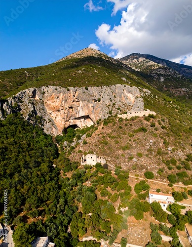 Mountainous landscape with a cave