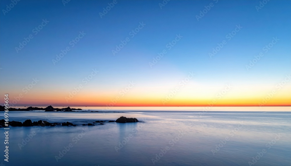 Fototapeta premium Blue hour wash with faint coastal glow on horizon clean background plane representing tranquil sky scene suitable for calm atmospheric design