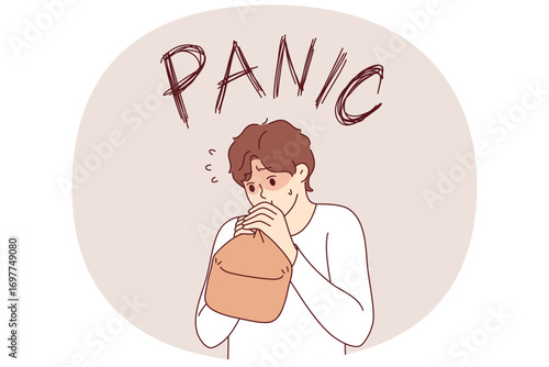 Panic attack in man breathing into paper bag to overcome fear and restore calm. Problem of panic attack for guy who needs sedative and antidepressants to relieve stress and depression