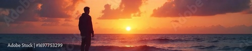 Silhouetted figure gazing at a breathtaking sunrise over a tranquil ocean, conveying a sense of peace and spiritual contemplation , spiritual, belief