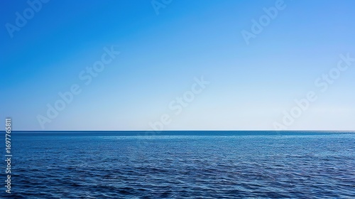 Wallpaper Mural Serenity Unbound: Breathtaking Scene of Blue Sky and Vast Sea – A Clear, Azure Sky Stretching Endlessly Above a Calm, Deep Blue Sea, Where the Horizon Blends Sky and Water into a Soft Line Torontodigital.ca