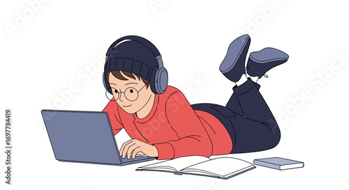 Young person wearing headphones engaged in online learning on a laptop while lying down