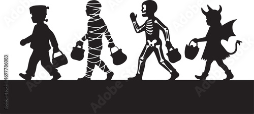 Four children in Halloween costumes walking with trick or treat bags candy