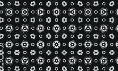 Geometric starburst like small and big flowers pattern in black and white. Abstract seamless decorative vector background for textile, fabric, interior, ceramic, wallpaper, paper decoration