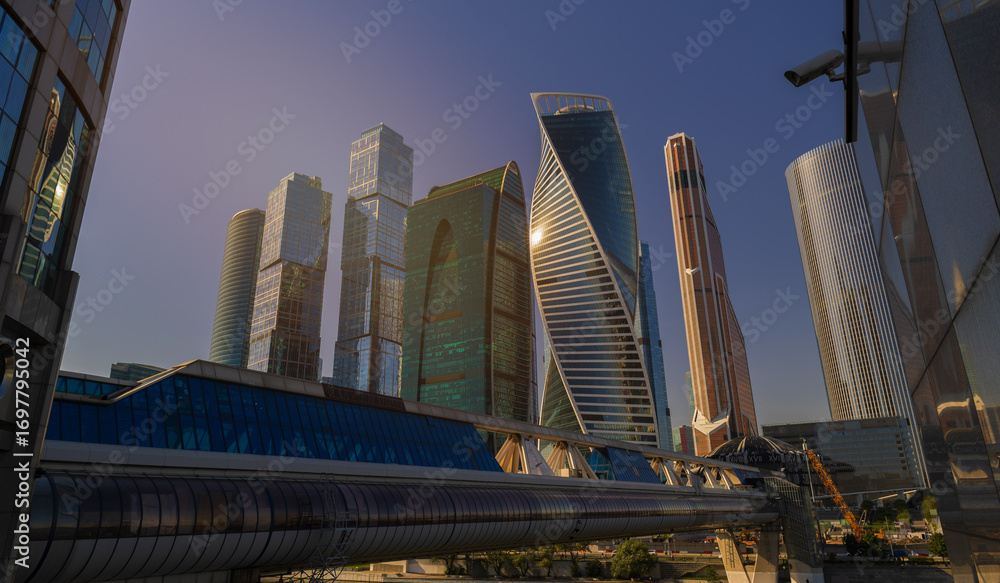 Naklejka premium High-rise buildings and skyscrapers on a sunny summer day.