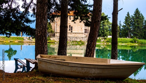 Lakeside tranquility with a weathered boat