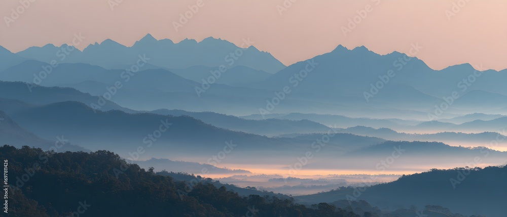 Fototapeta premium sunrise valley mountain peaks misty
