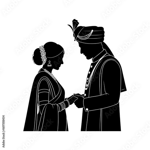 Silhouette of an Indian bride and groom holding hands during a wedding ceremony, facing each other.