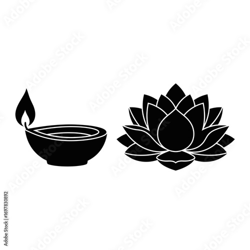 A black silhouette of a traditional Diya oil lamp next to a blooming lotus flower.