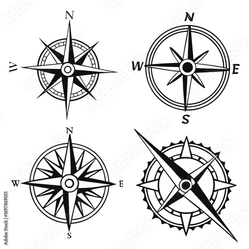 Collection of four stylized black and white compass rose illustrations showing cardinal directions north south east west