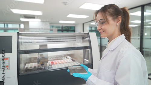 Wallpaper Mural Laboratory technician operates advanced diagnostic equipment in modern research facility Torontodigital.ca