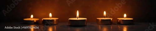 Several flickering candle flames illuminate a dark room, casting warm, dancing shadows on the surrounding surfaces The gentle glow creates a peaceful, intimate atmosphere , meditation, aura