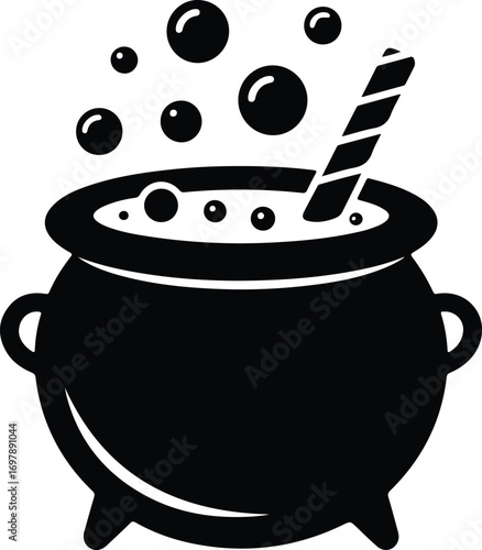 Bubbling cauldron with stirring stick for Halloween